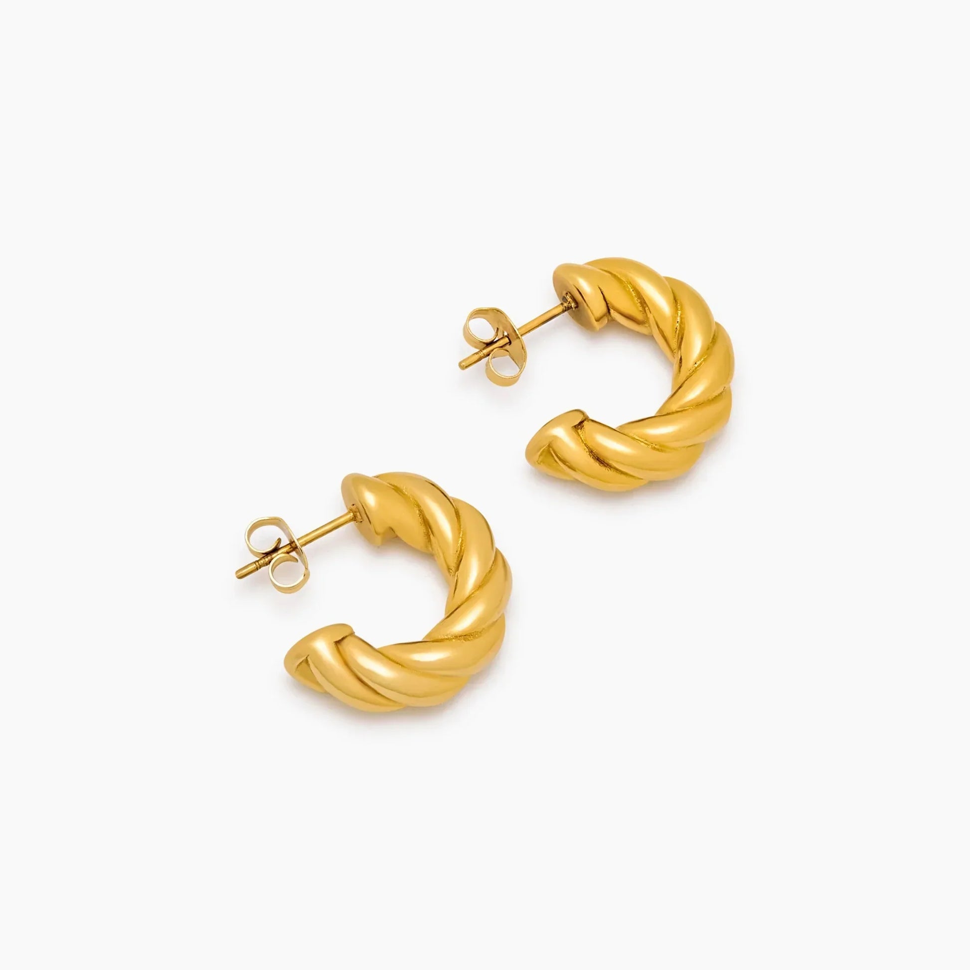 Demi twist earrings flat lay — Olivia Jewelry