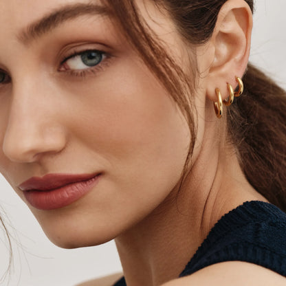 Gold hoop earrings worn — Olivia Jewelry