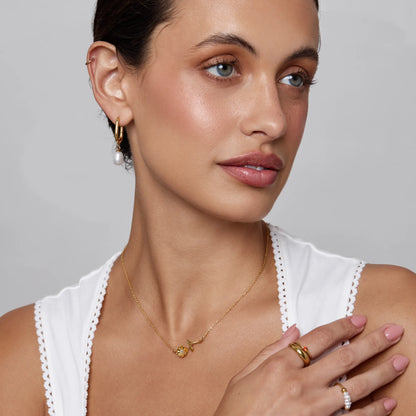 Birth flower necklace flat lay — Olivia Jewelry